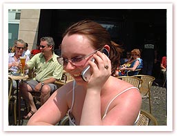 Image: Sherrie on the phone to her mum in the main square