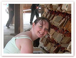 Image: Sherrie writing her prayer at the Meiji-jingu temple